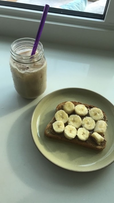 Banana on toast on a green plate