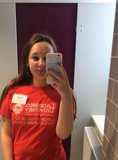 Digital Content Ambassador Holly wearing a Student Ambassador t-shirt