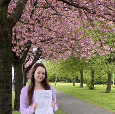 Holly amongst the blossom trees on campus