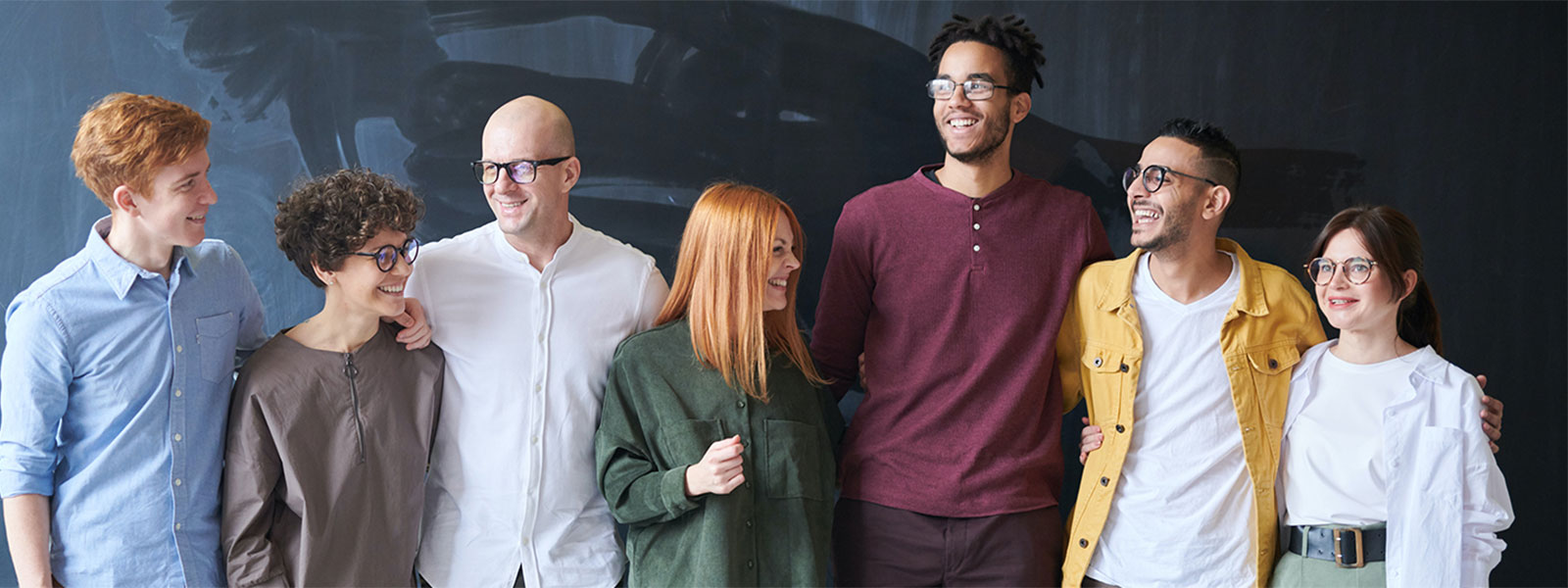 Line of different people smiling