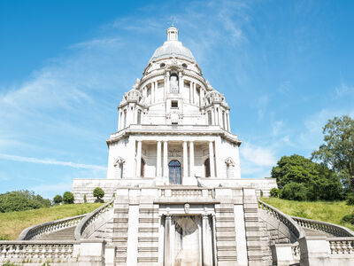 Ashton Memorial, a large folly, encased in white stone with a large majestic green dome.