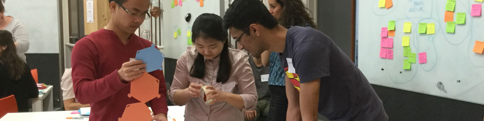 Large photo displaying collaborating students