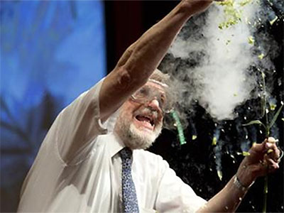 Professor William Phillips, wearing safety glasses, conducting a dramatic experiment