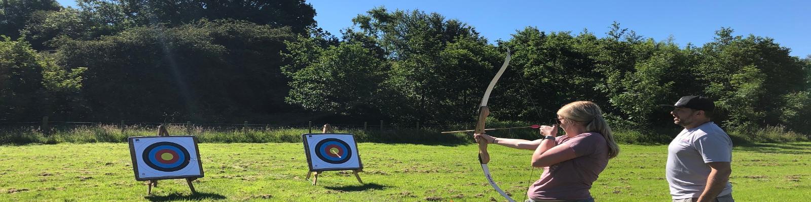 Person taking part in archery class