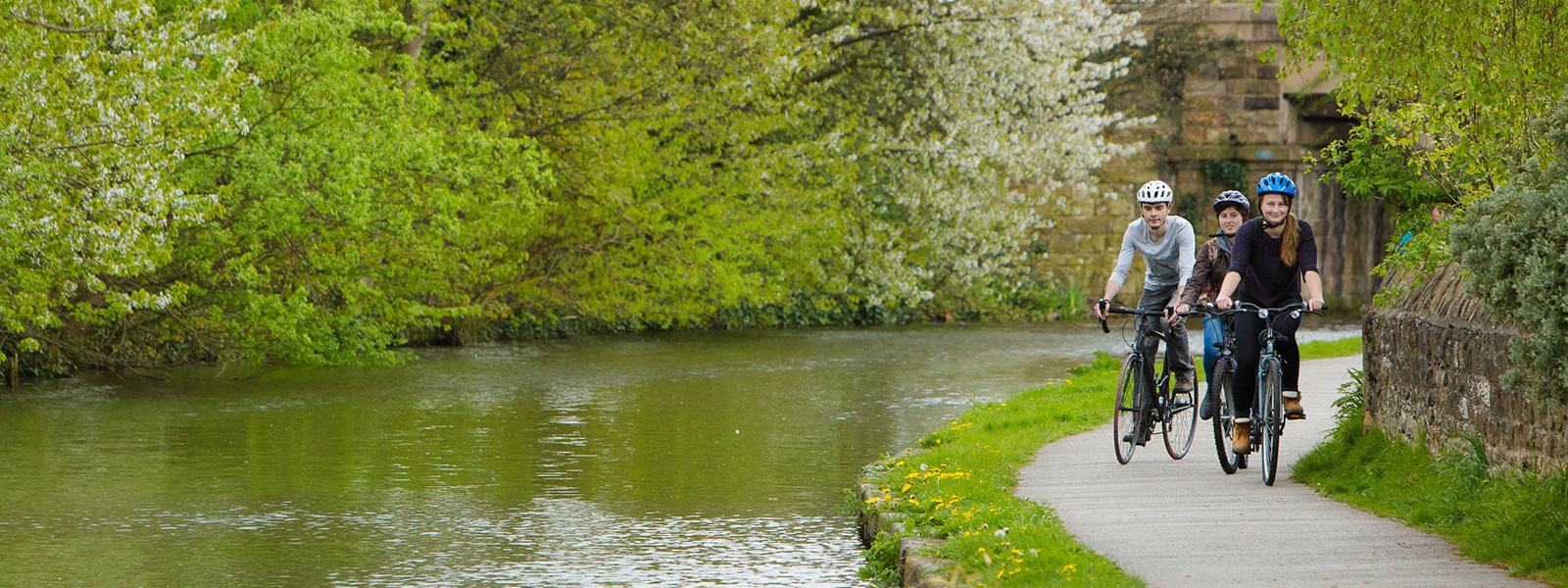 A trio of cyclists on Lancaster canal.