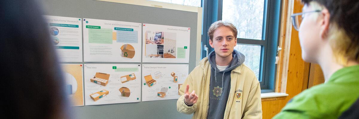 A student demonstrating a design project