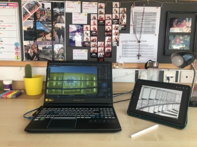 Tai's desk showing laptop and tablet