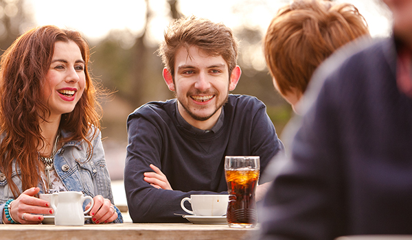 Students socialising by canal in Lancaster
