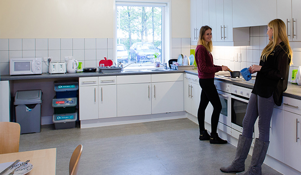 Students in a shared kitchen