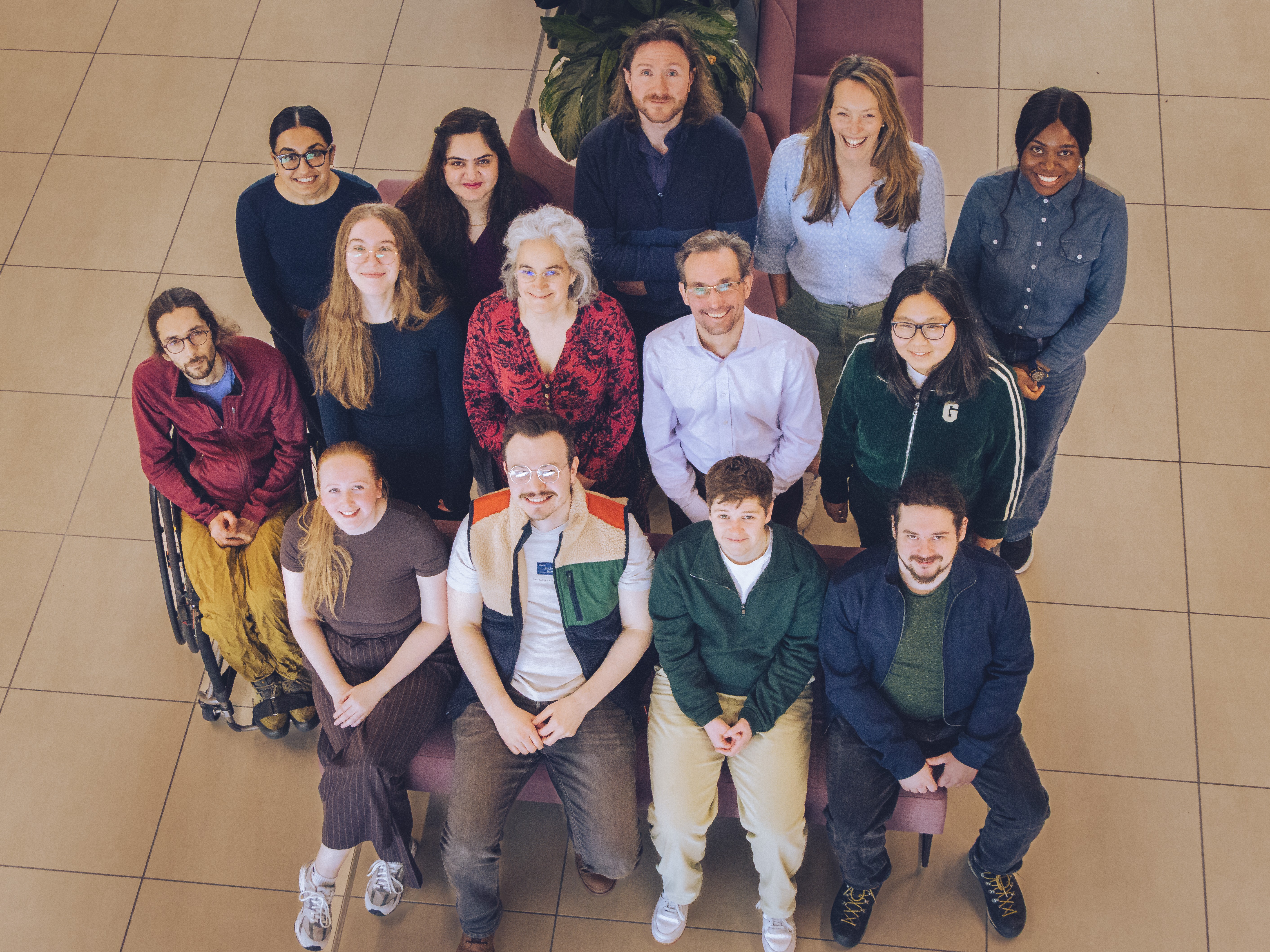 CHICAS members sat on wooden tiered steps