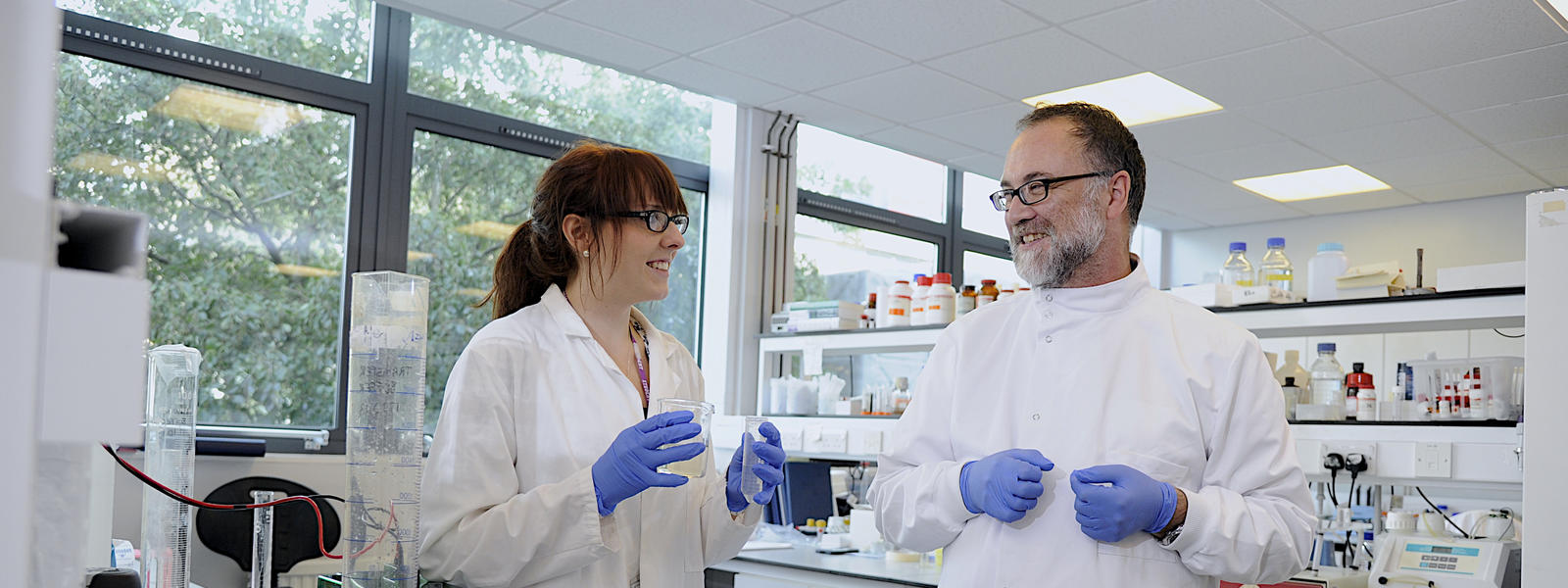 A student and supervisor coordinating together in a new laboratory.