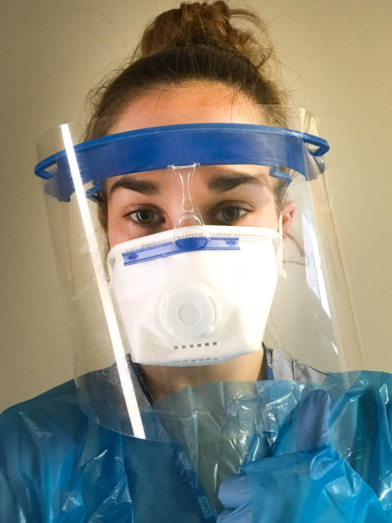 A young woman wearing personal protective clothing.