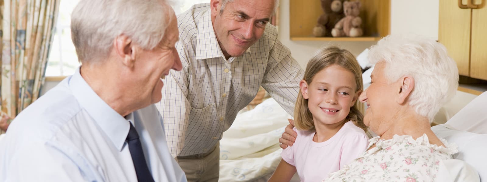 Elderly woman surrounded by family