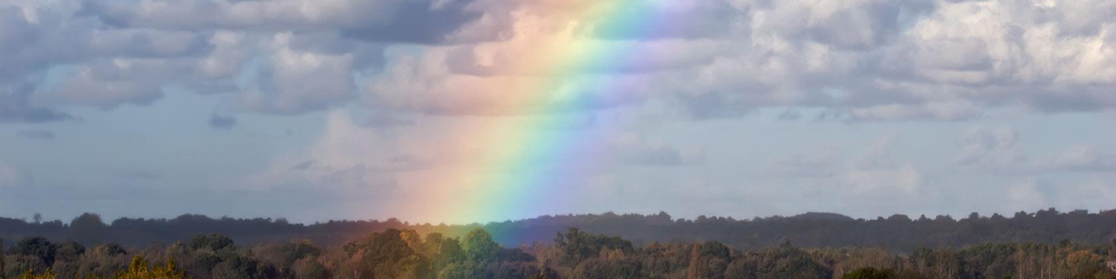 Rainbow in a cloudy sky