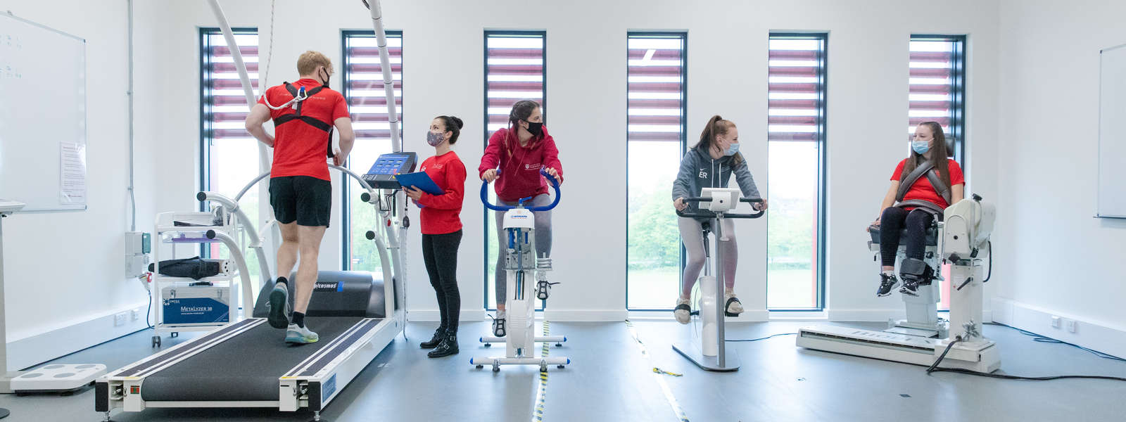 Five students using elite sporting equipment in the Human Performance Laboratory 