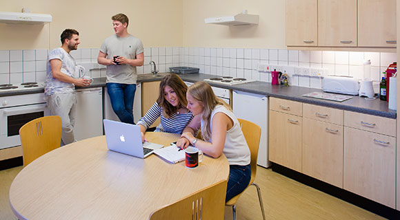 Students in their kitchen.