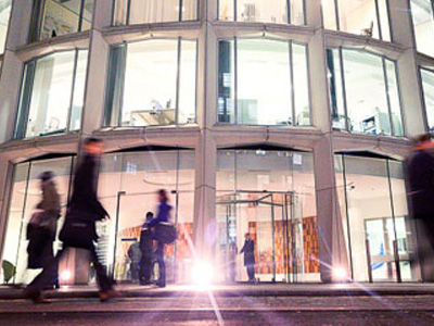 People walking in front of the Asticus building in London