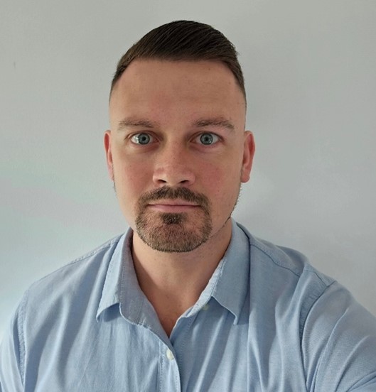 A photograph of Sam Rust