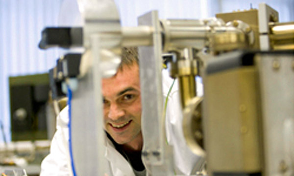 A member of staff uses equipment in the Noble Gas Laboratory