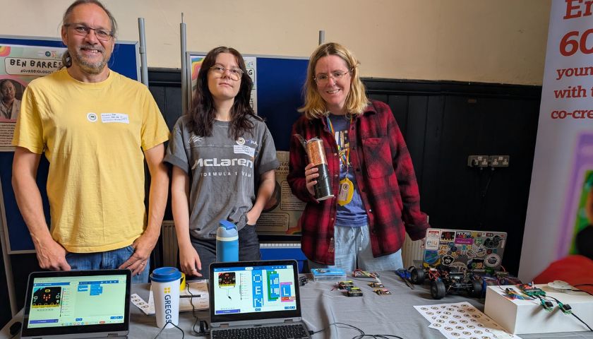 Lorainne, Joe, and a student helper at Pride in STEM