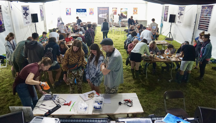 A crowd of people in the Physics Pavillion at WOMAD 2023
