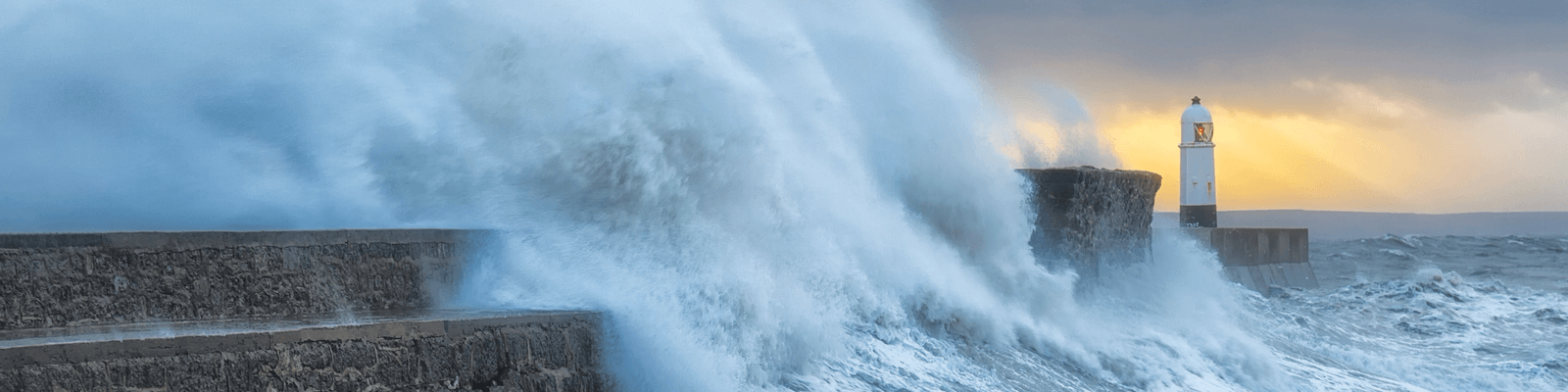 A stormy sea battering a lighthouse