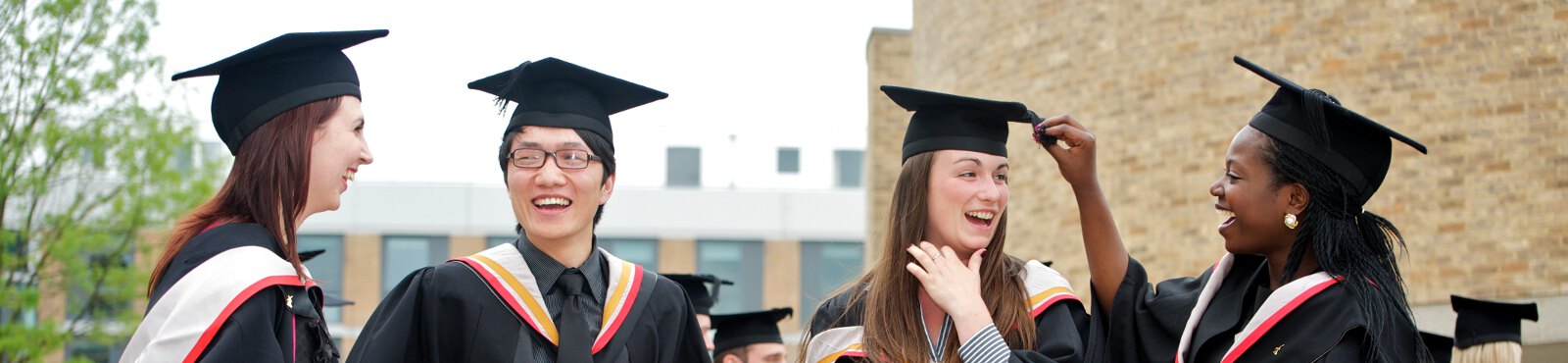 Students chatting after graduation