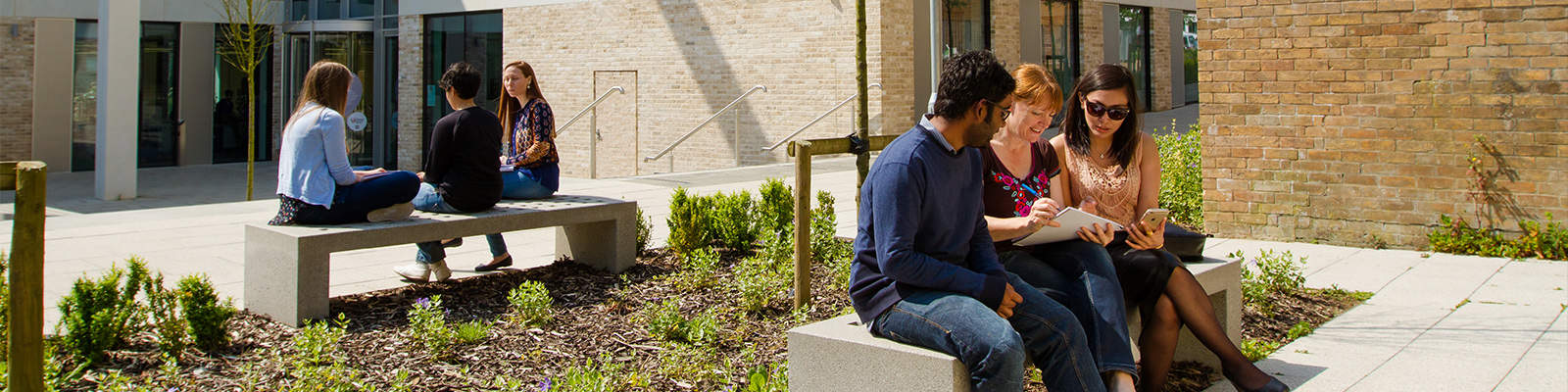 People on a bench outside the Engineering building