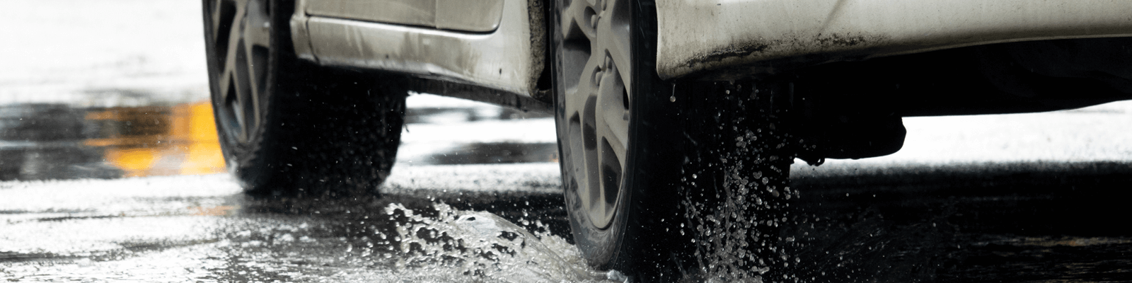 A car driving through a puddle