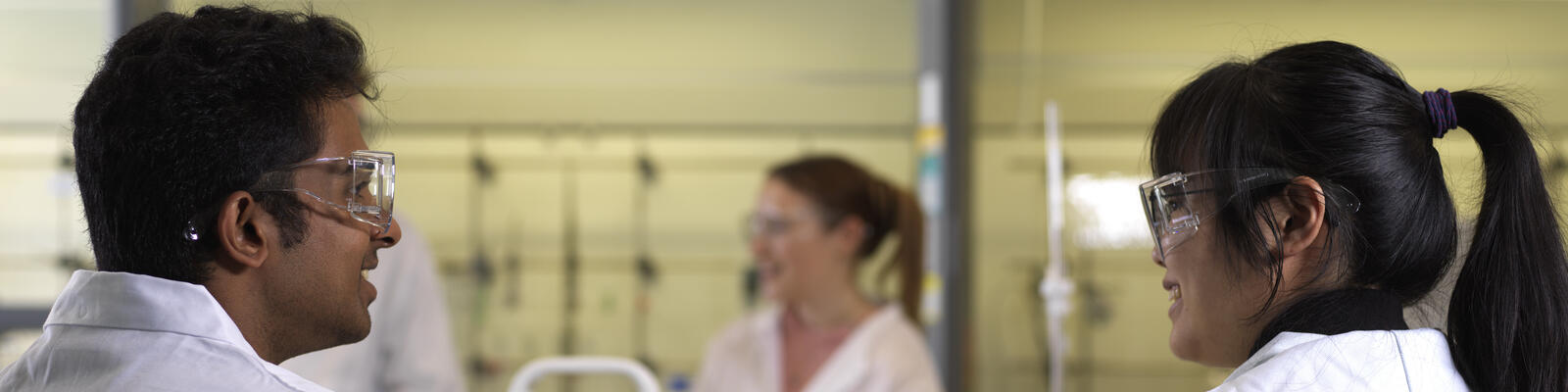 Two students in lab coats