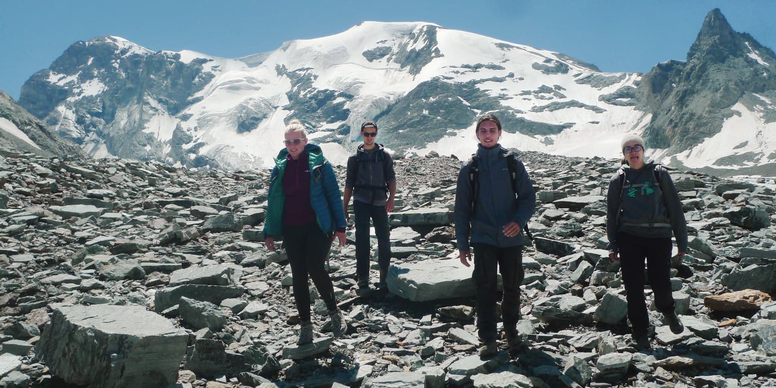 Students on the side of a snowy mountain