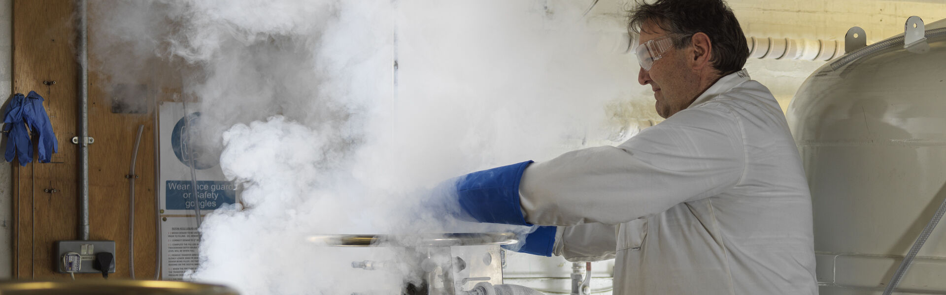 A technician handling cryo liquids