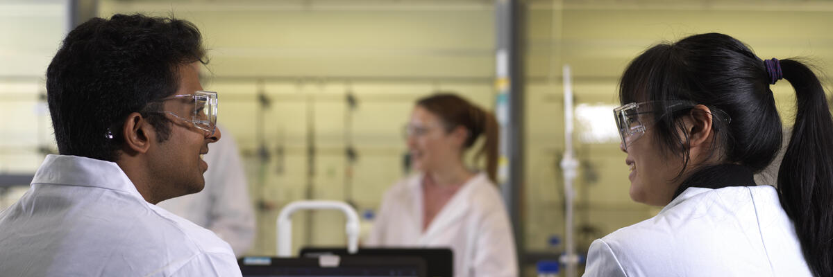 Two students sat talking in the chemistry lab