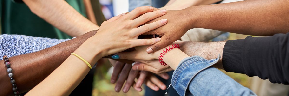 People holding hands in a circle