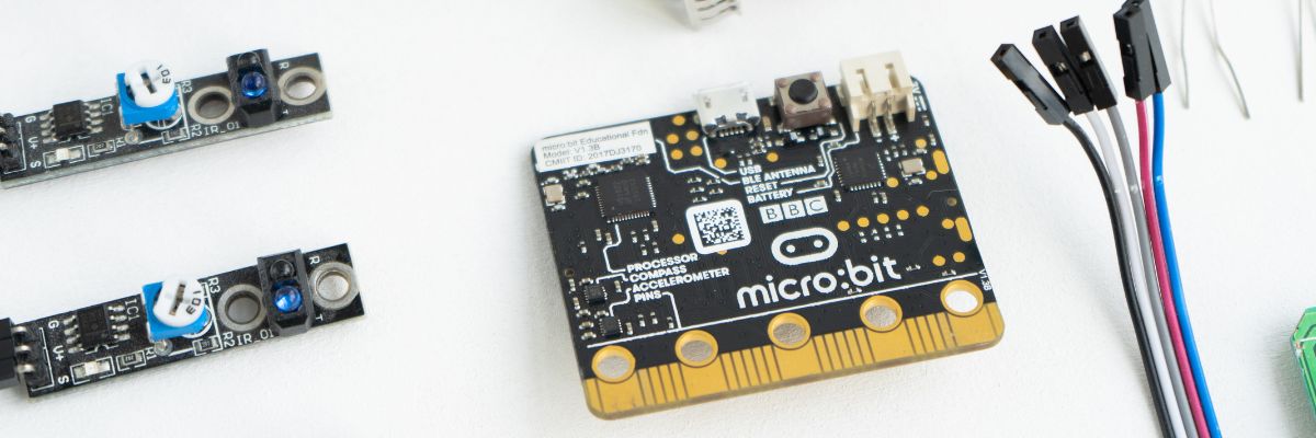 A micro:bit on a table with some wires