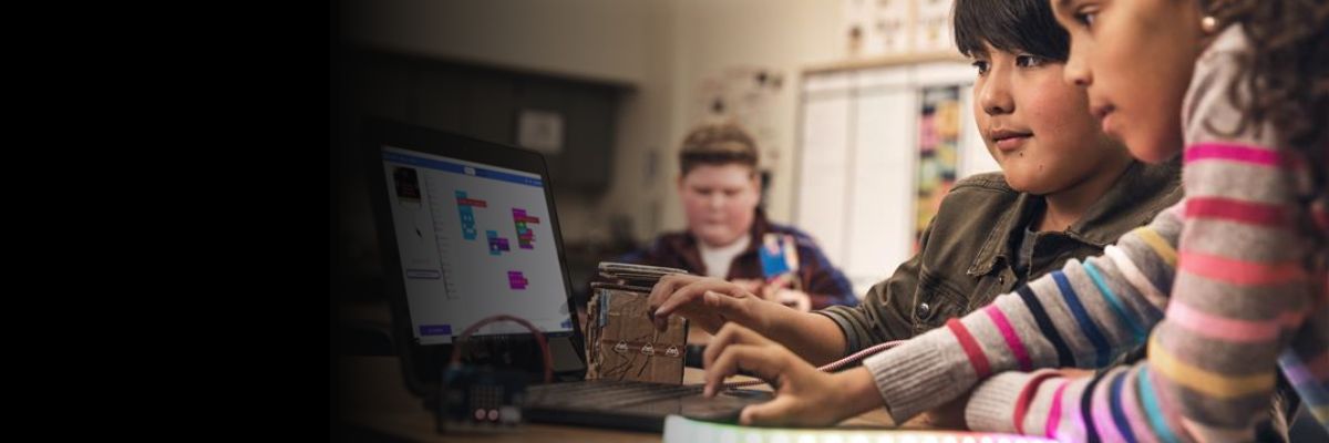 Some children coding with the micro:bit