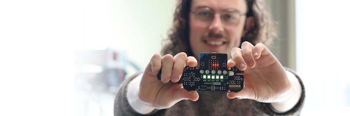 A person holding a micro:bit