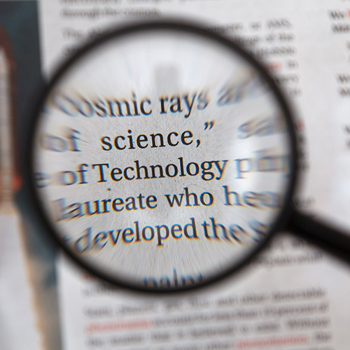 A magnifying glass positioned over the words
