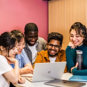 Students working at a laptop