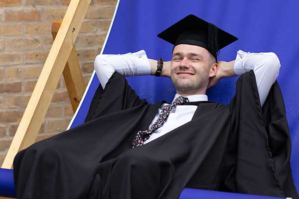 Furness student in a Grad cap