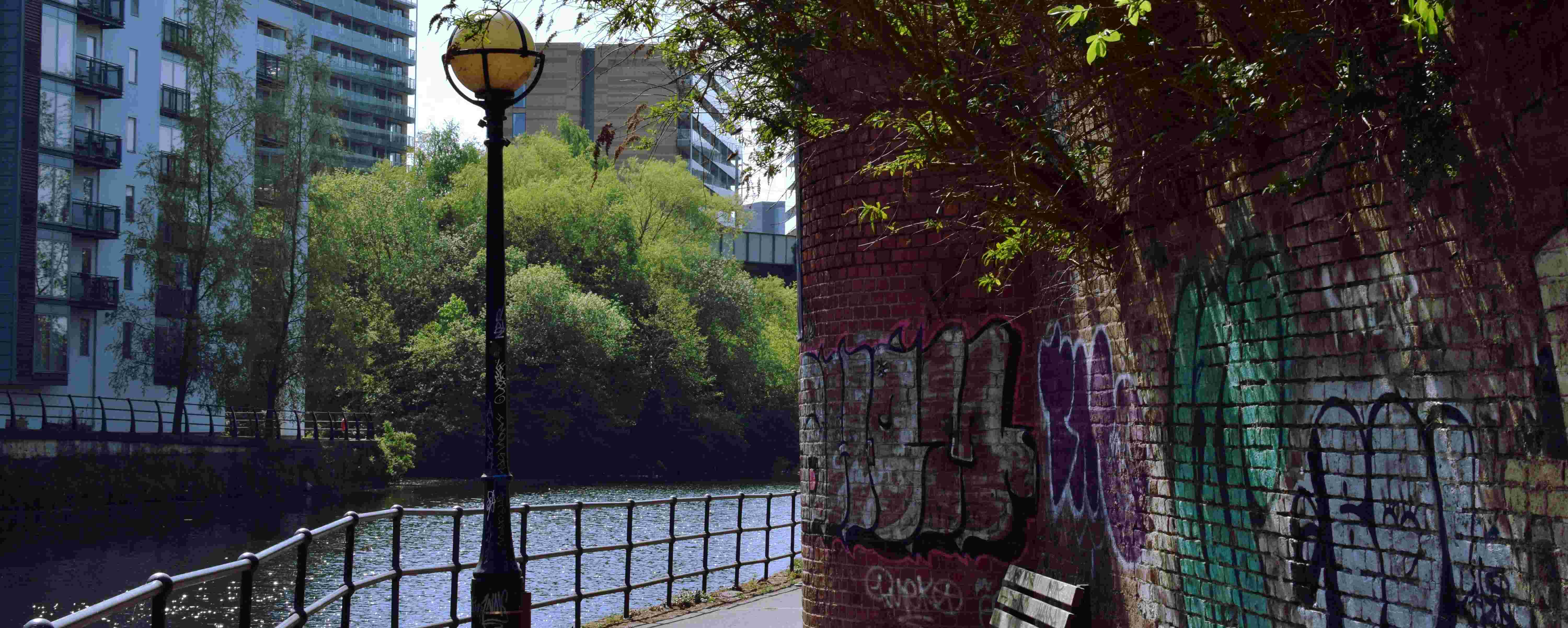 An image of an urban river and path