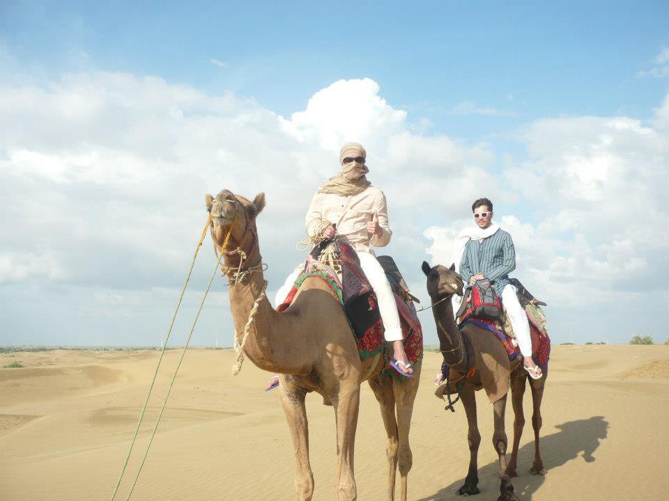 Picture of fylde students on a camel on a trip made possible by the Fylde Scholarship
