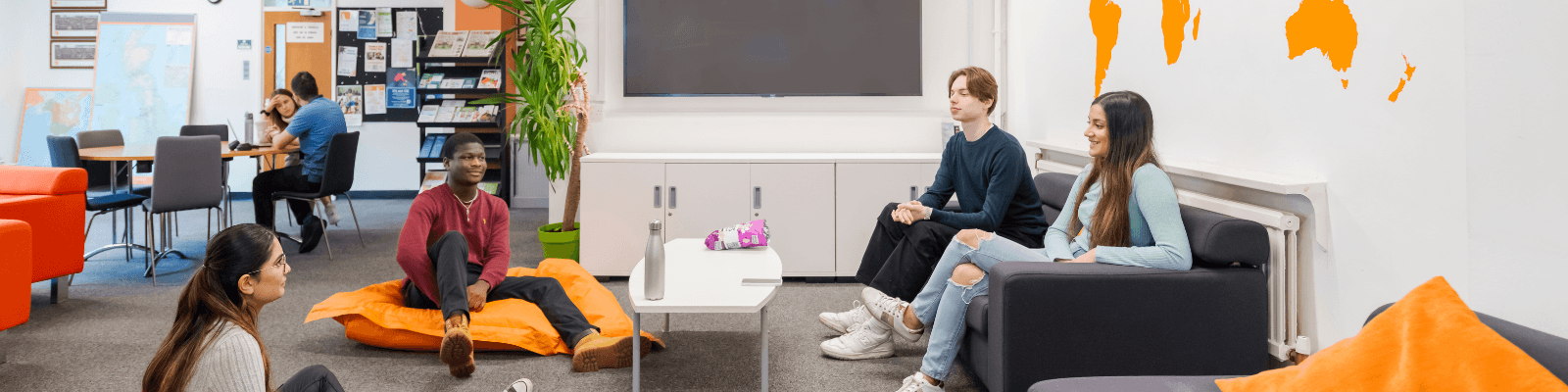 Photo shows students sitting together in the Fylde Common Room