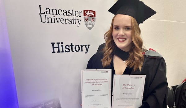 History Student with certificates for two prizes she has won