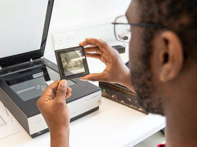 History student scanning a historic photograph