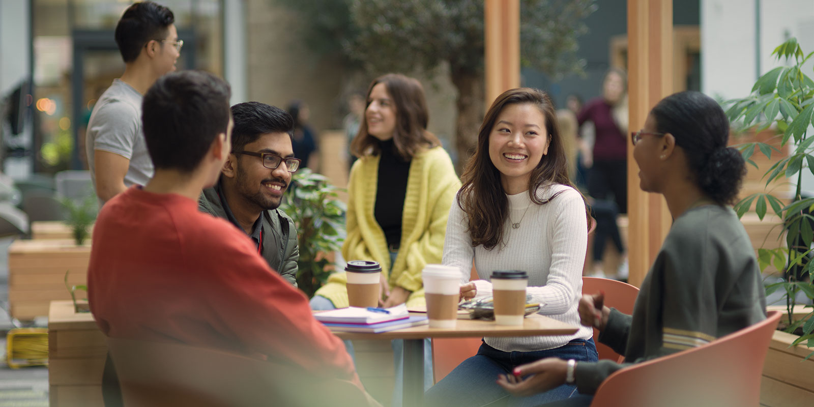 Students sitting around a table chatting