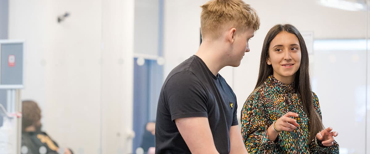 Two students chatting and joking