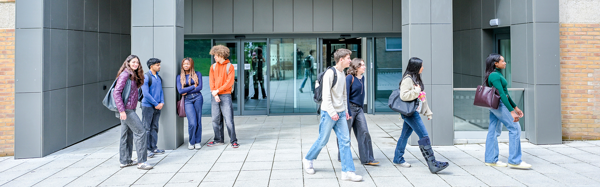 Students walking on campus on a sunny day