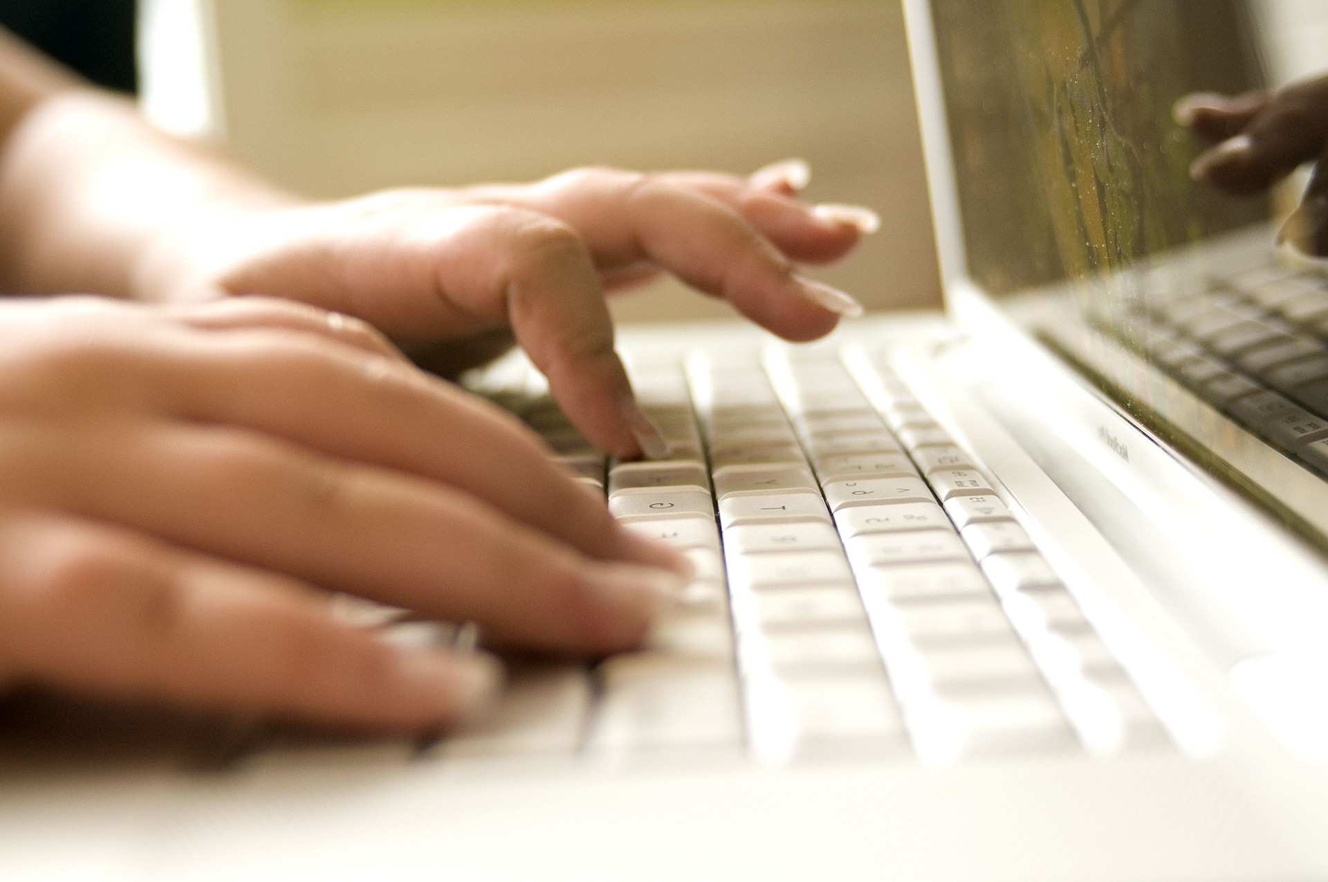 person typing at pc