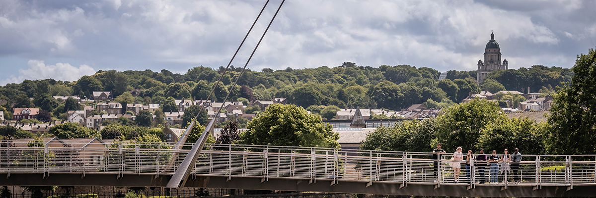 Lancaster Millennium bridge with a view of Ashton Memorial in the background